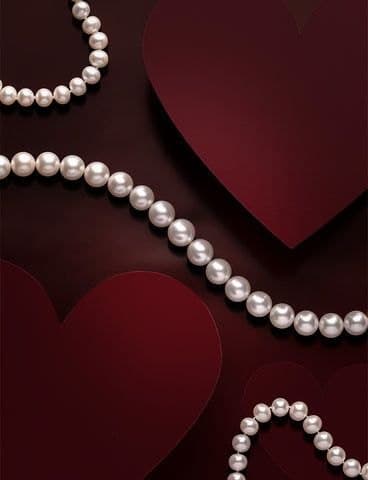 Pearl strand on red satin
